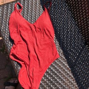 Red high leg low back one piece